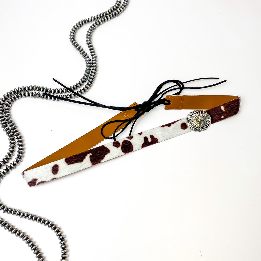 Back Road Chillin Cow Print Hat Band in Dark Brown/Silver Tone - Giddy Up Glamour Boutique