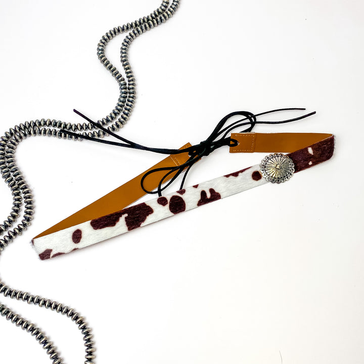 Back Road Chillin Cow Print Hat Band in Dark Brown/Silver Tone - Giddy Up Glamour Boutique