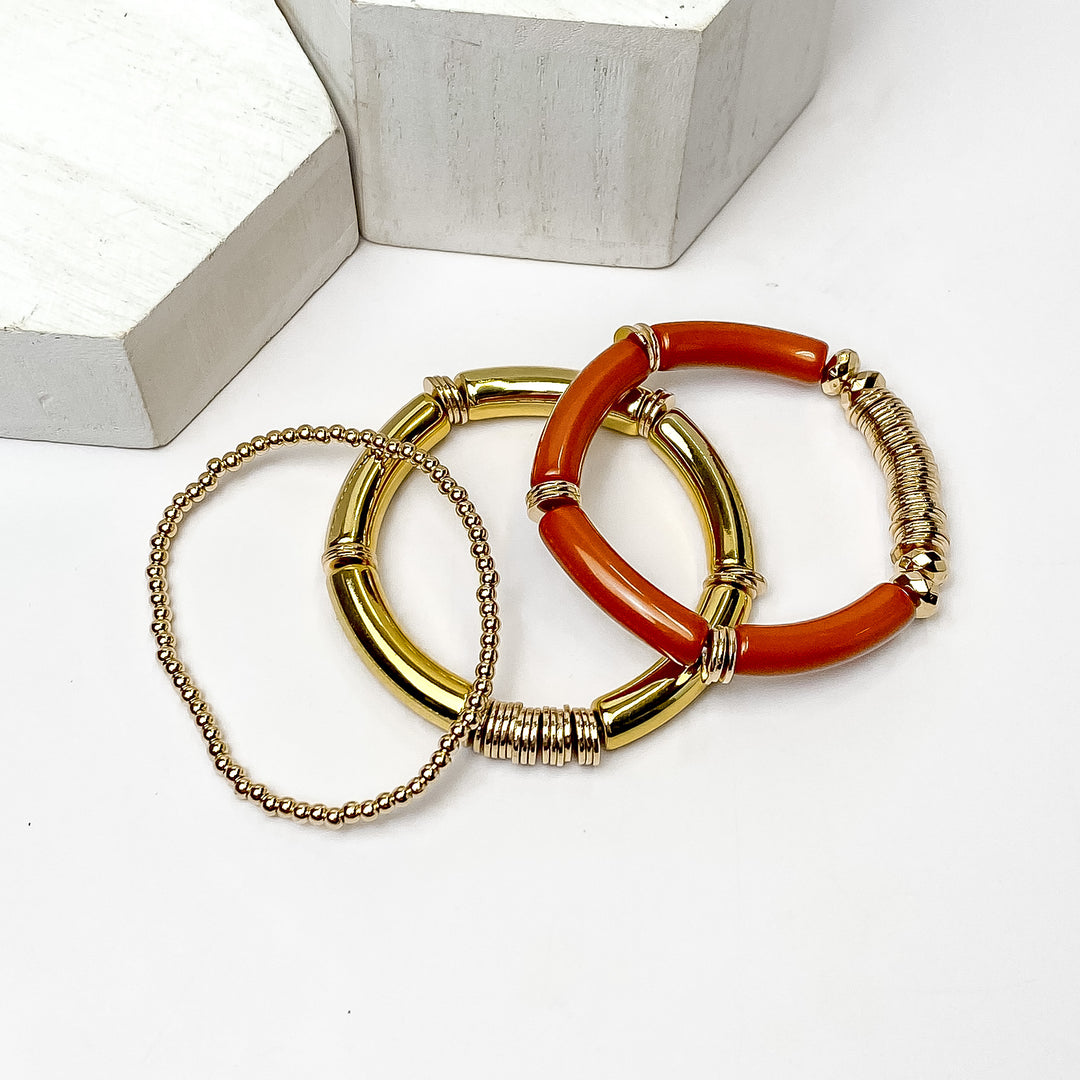 Set of Three | Bahama Nights Gold Tone Tube Bracelet Set in Burnt Orange - Giddy Up Glamour Boutique