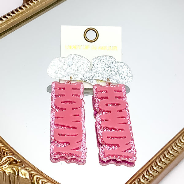 HOWDY Earrings with Silver Tone Cowboy Hat Post in Pink. Pictured on a mirror with a gold trim