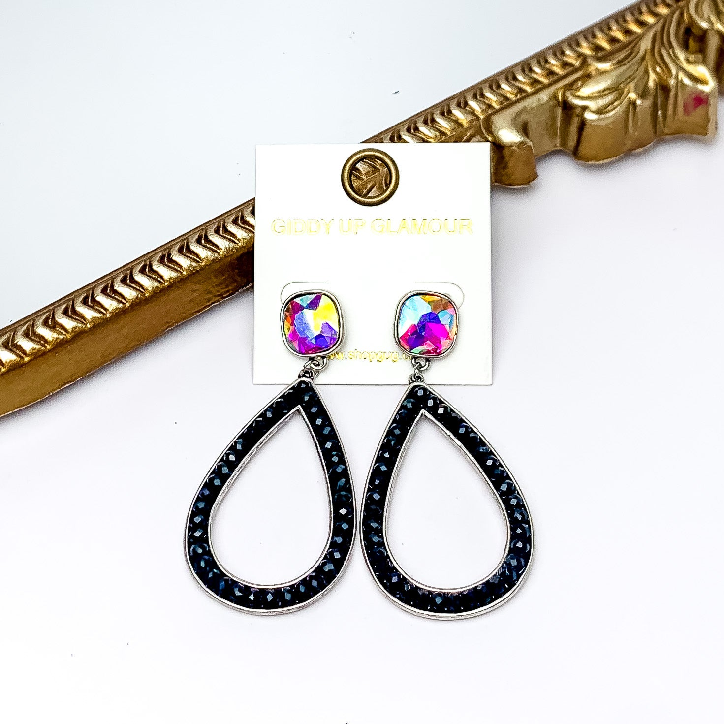 Glass Beaded Teardrop Post Earrings with AB Crystal in Black. Pictured on a white background with a gold frame behind the earrings.
