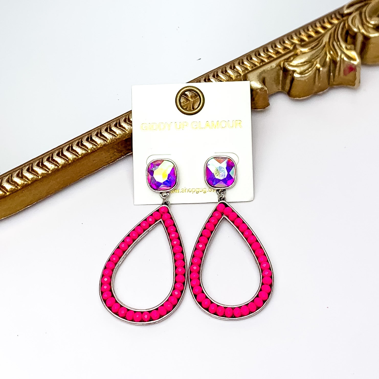 Glass Beaded Teardrop Post Earrings with AB Crystal in Pink. Pictured on a white background with a gold frame behind the earrings.