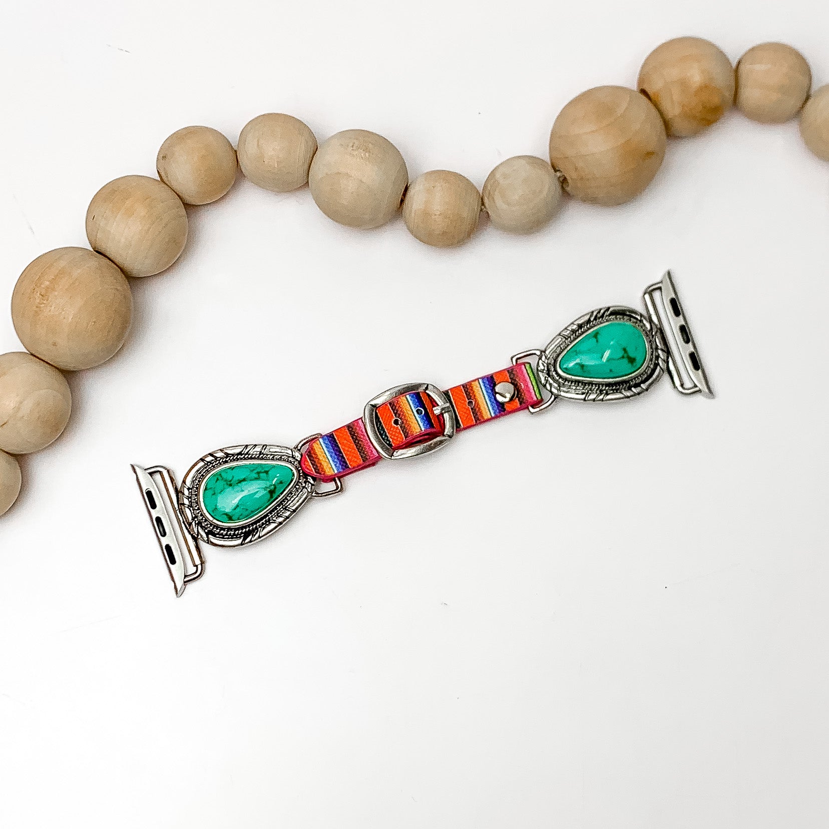 Turquoise Stone Watch Band With Colorful Stripes. Pictured on a white background with the watch band below wooden decorative beads.