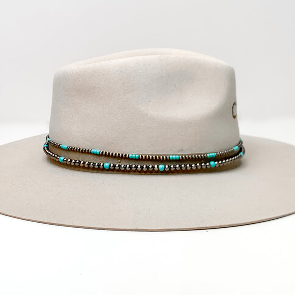 Copper Tone and Turquoise Pearl Hat Band With Black Tie Strings. Pictured on a white background with the band around a light brown/ gray hat.
