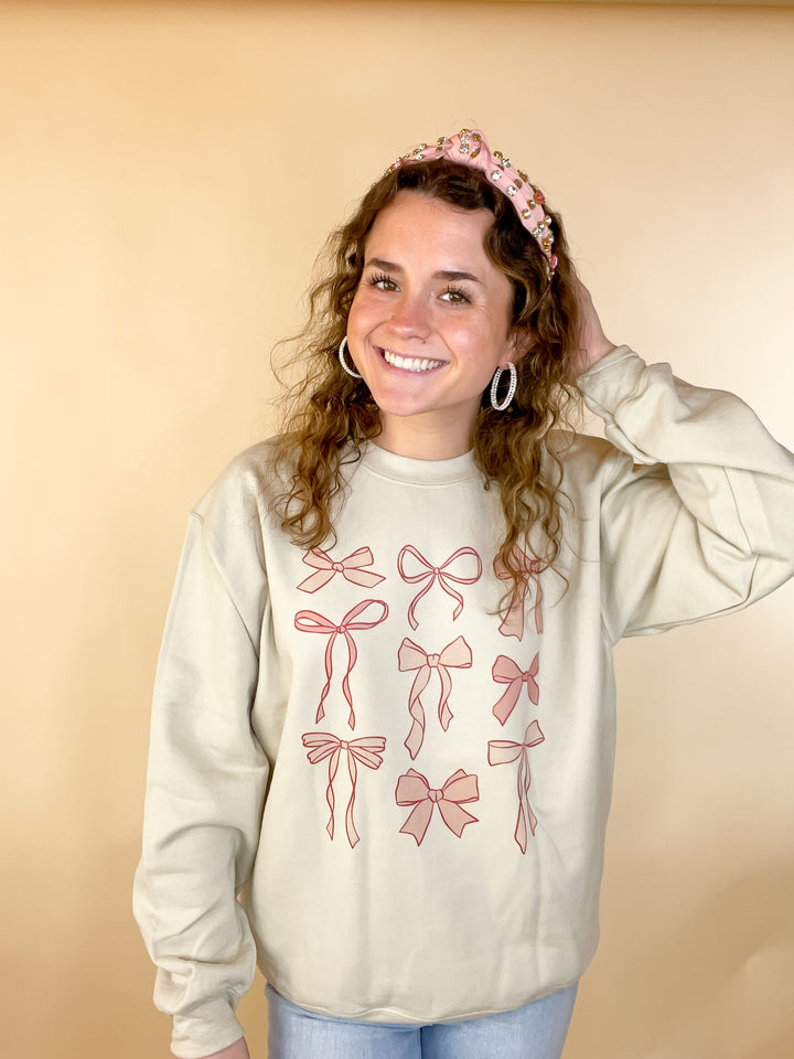 Online Exclusive | Coquette Bow Long Sleeve Graphic Sweatshirt in Cream - Giddy Up Glamour Boutique