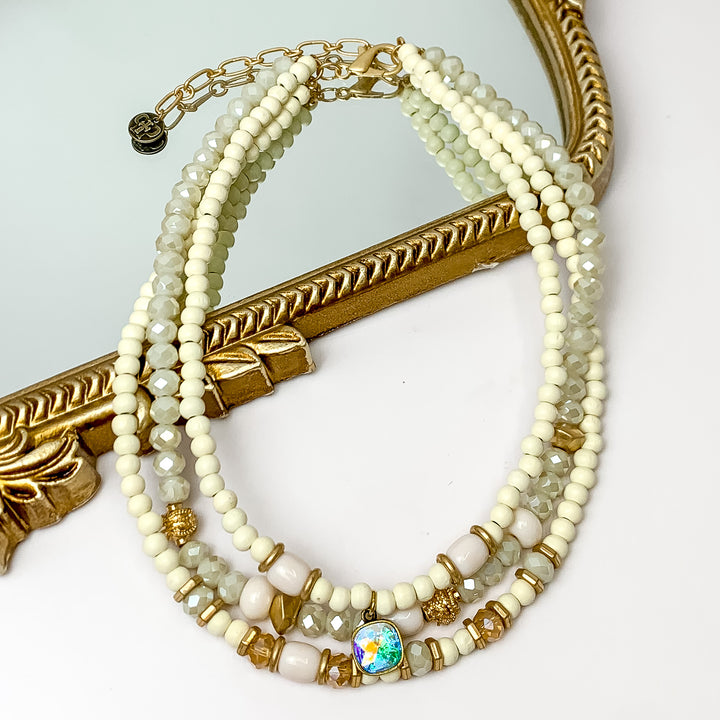 Pink Panache | Three Strand Ivory Crystal and Wood Beaded Necklace AB Cushion Cut Drop - Giddy Up Glamour Boutique