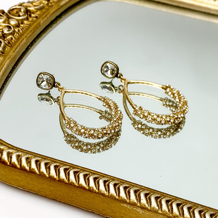 Pink Panache | Clear Cushion Cut Post Earrings with Gold Tone Teardrop Pendants Wrapped in Clear Crystals - Giddy Up Glamour Boutique