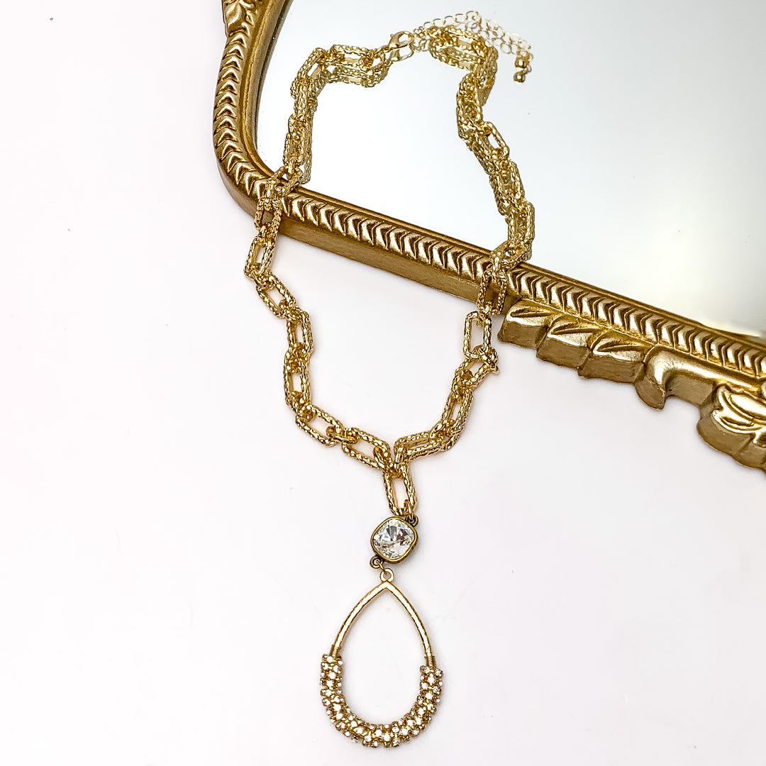 Pink Panache | Hammered Gold Tone Chain Necklace with a Clear Cushion Crystal and Gold Teardrop Pendant Wrapped in Clear Crystals - Giddy Up Glamour Boutique