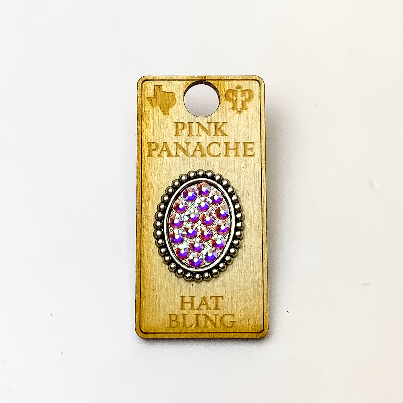 Silver, oval hat pin with a ab crystal inlay. This hat pin is pictured on a wooden Pink Panache holder on a white background. 