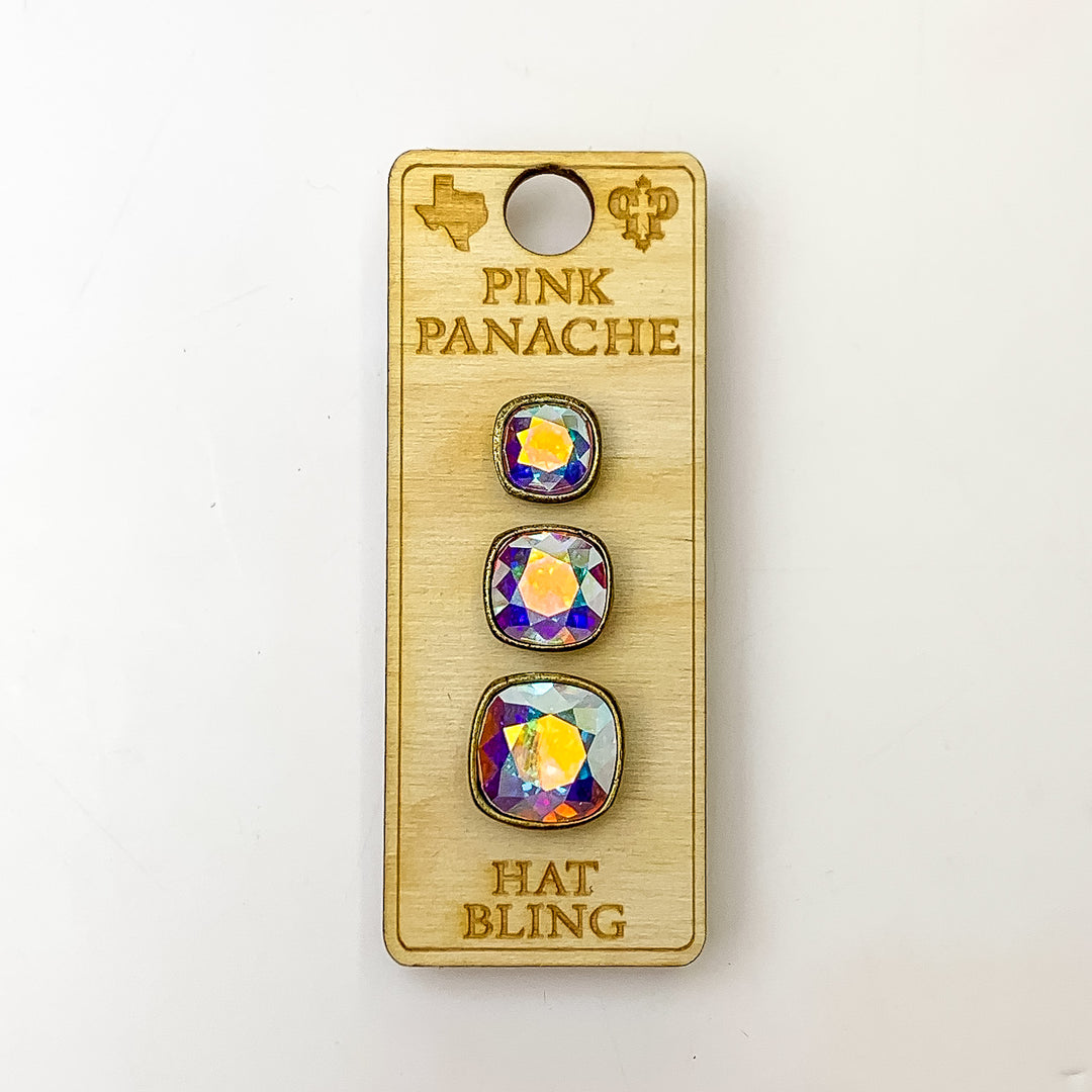 Three bronze, square hat pins going smallest to biggest with ab cushion cut crystal. This hat pin is pictured on a wooden Pink Panache holder on a white background.