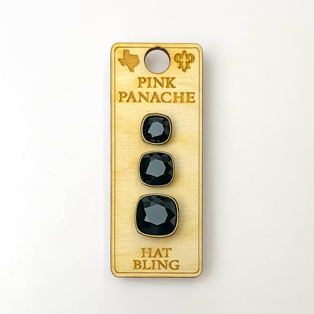 Three bronze, square hat pins going smallest to biggest with black cushion cut crystal. This hat pin is pictured on a wooden Pink Panache holder on a white background.