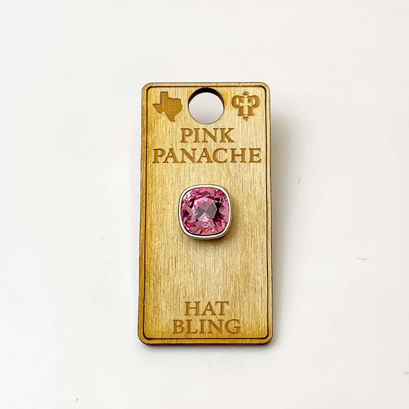 Silver, square hat pin with a light rose cushion cut crystal. This hat pin is pictured on a wooden Pink Panache holder on a white background.