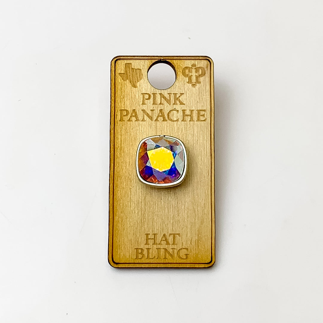 Silver, square hat pin with an ab cushion cut crystal. This hat pin is pictured on a wooden Pink Panache holder on a white background.