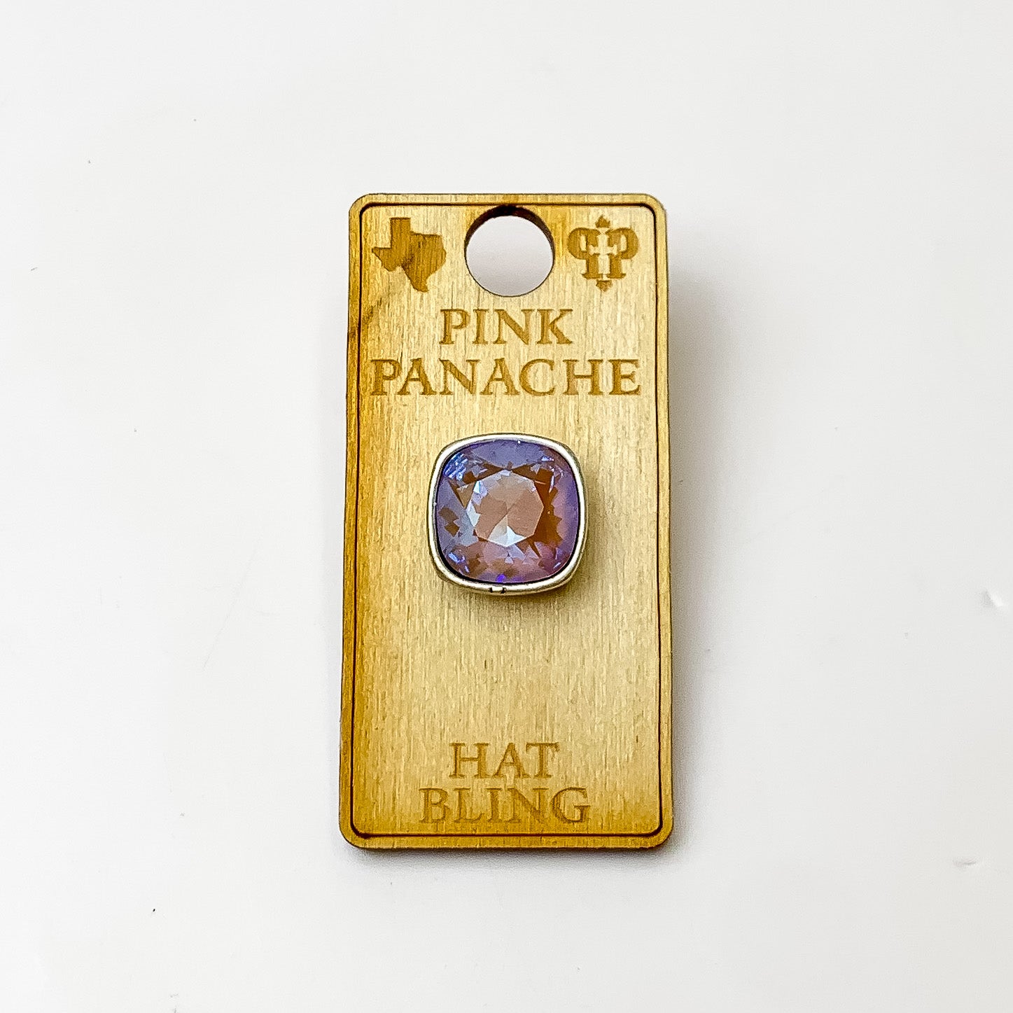 Silver, square hat pin with a cappuccino delight cushion cut crystal. This hat pin is pictured on a wooden Pink Panache holder on a white background.