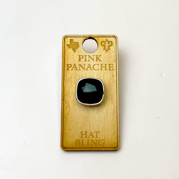Silver, square hat pin with a black cushion cut crystal. This hat pin is pictured on a wooden Pink Panache holder on a white background.