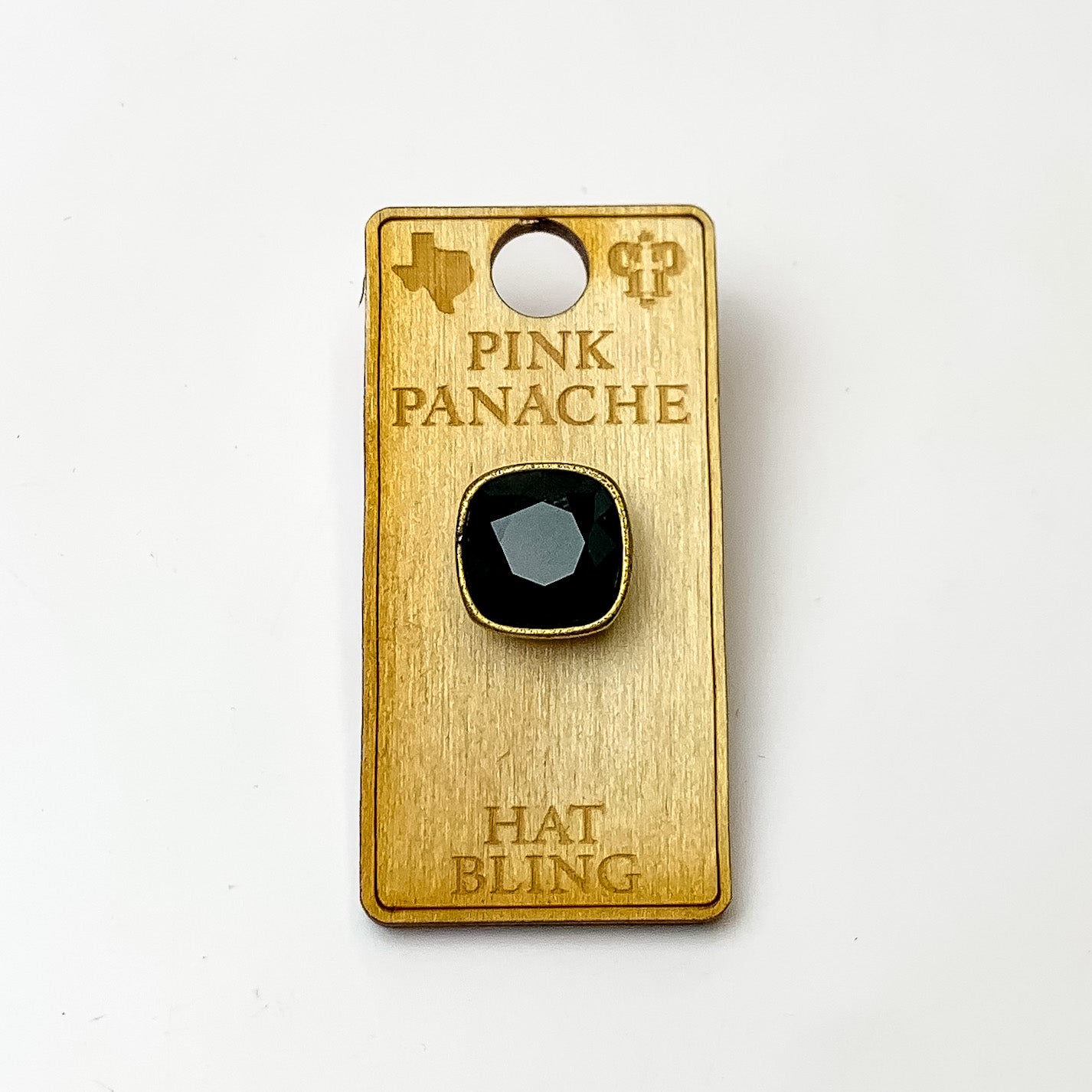 Bronze, square hat pin with a black cushion cut crystal. This hat pin is pictured on a wooden Pink Panache holder on a white background.
