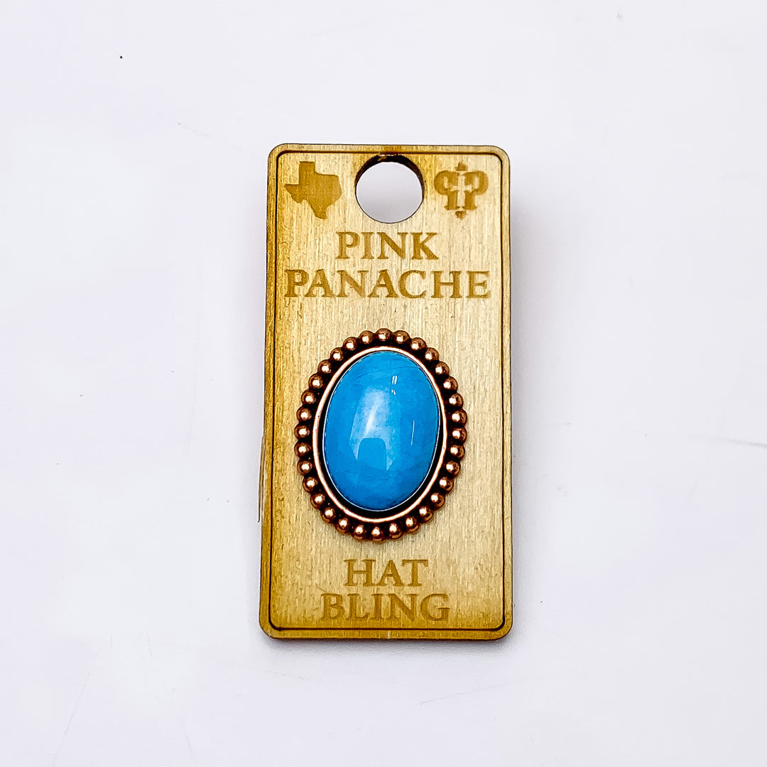 Pink Panache | Rose Gold Tone Oval Hat Pin with Turquoise Cabochon Stone. Pictured on a white background.