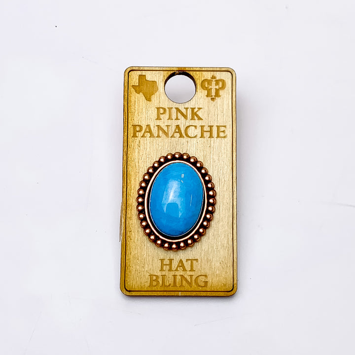 Pink Panache | Rose Gold Tone Oval Hat Pin with Turquoise Cabochon Stone. Pictured on a white background.