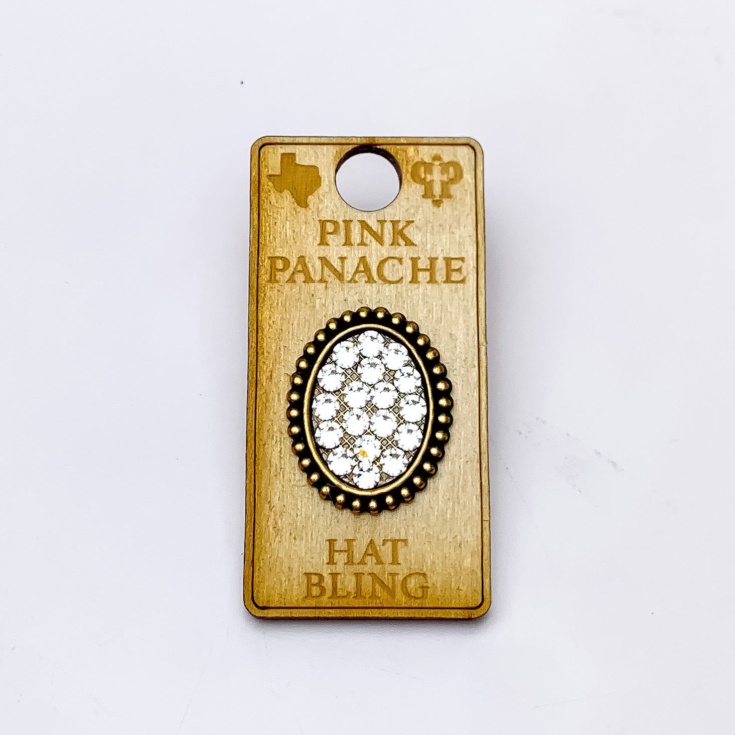 Pink Panache | Bronze Tone Oval Hat Pin with Clear Crystals. Pictured on a white background.