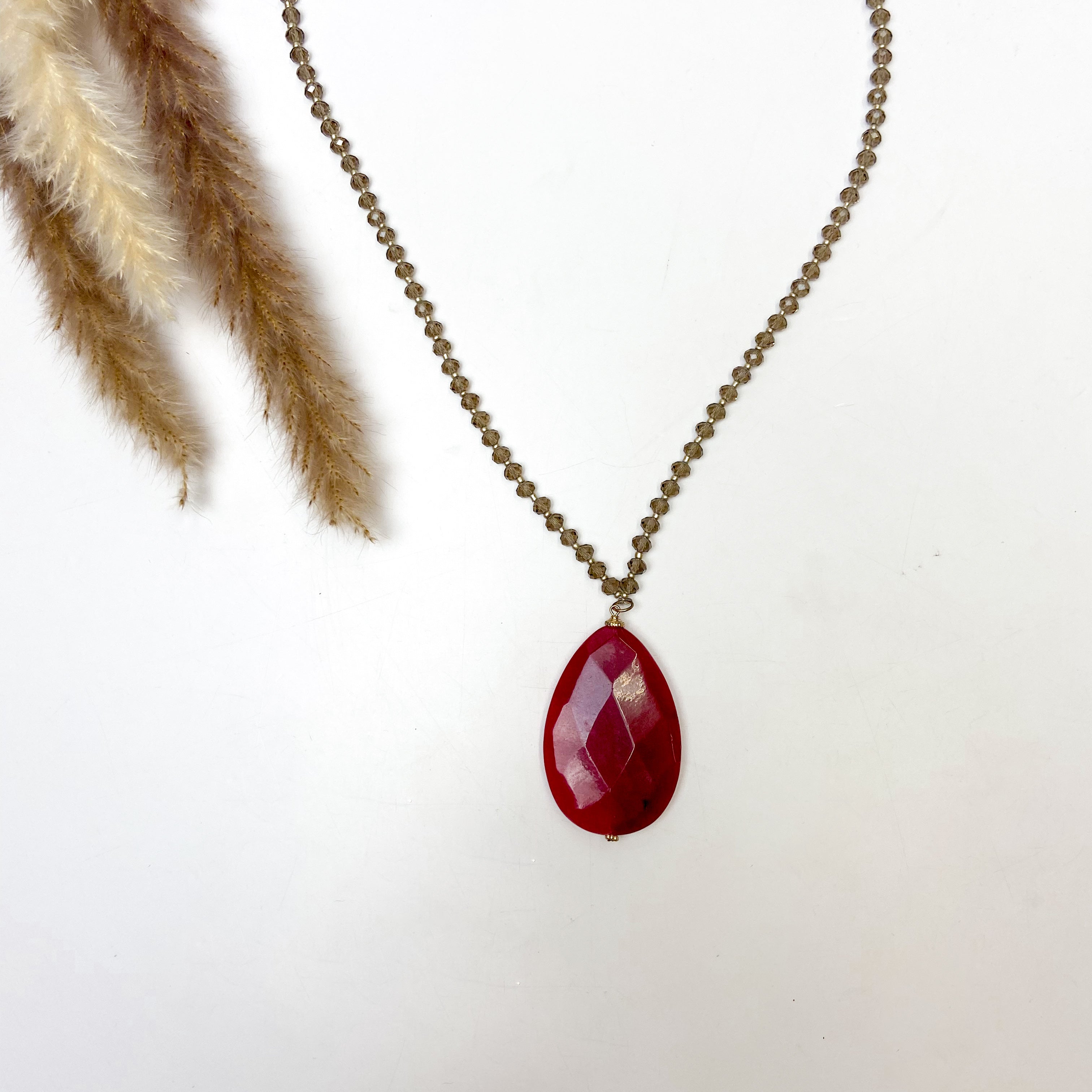 Gold Tone Beaded Necklace With Red Stone Pendant