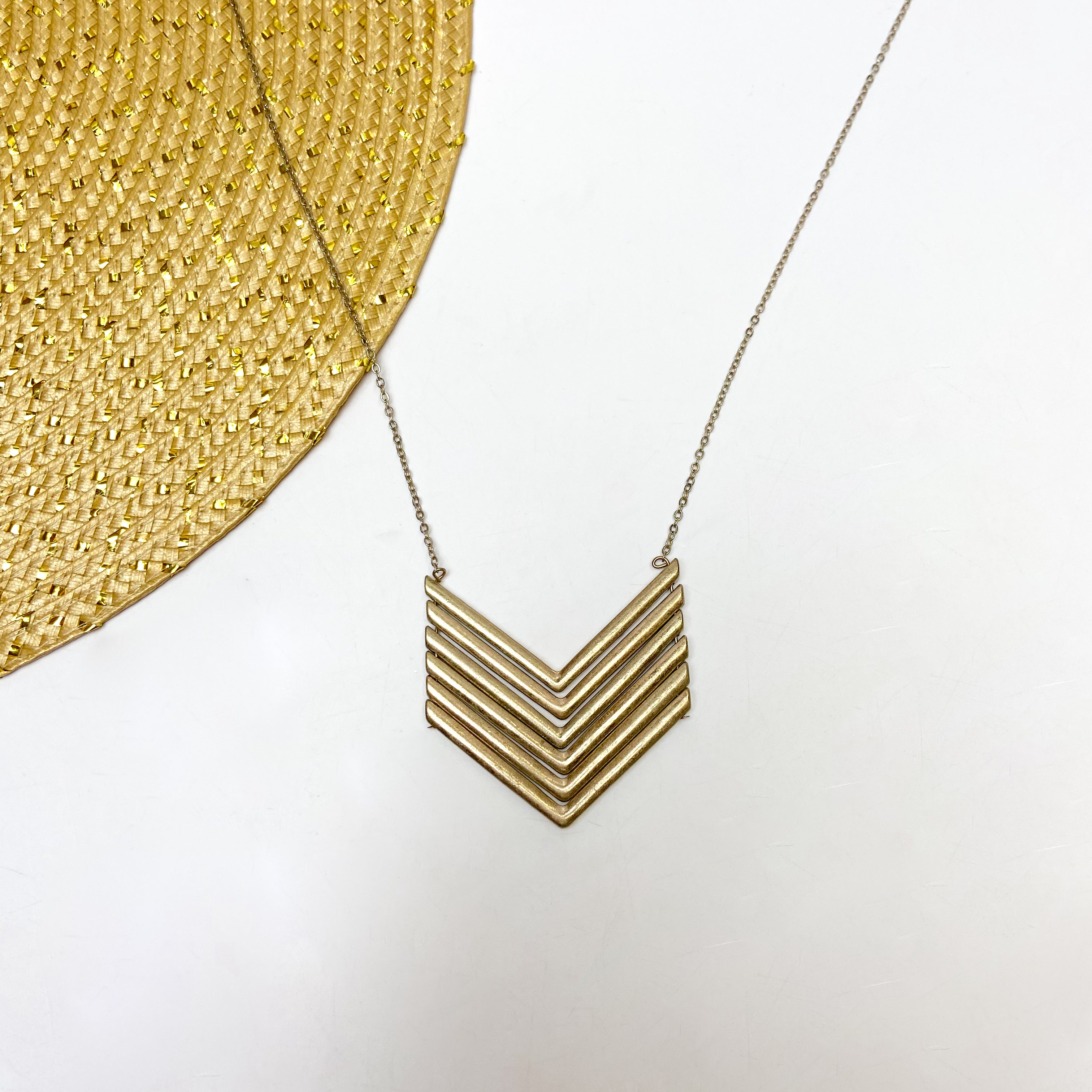 Long Gold Tone Necklace with Chevron Pendant