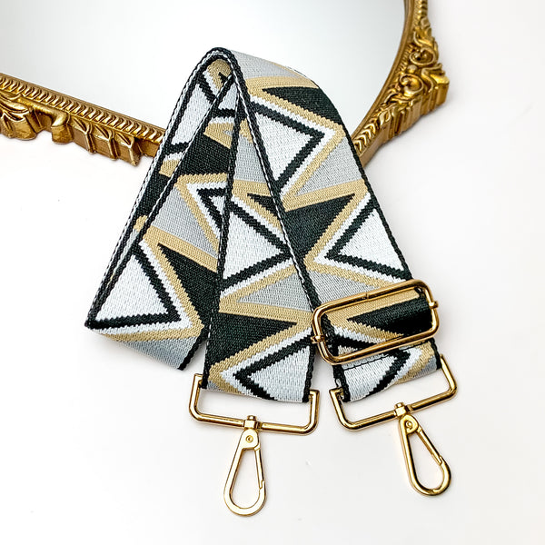 Embroidered Adjustable Purse Strap in Black. This purse strap is pictured on a white background with a gold trimmed mirror in the corner.