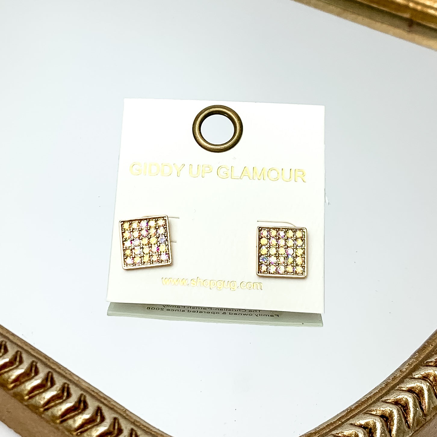 Square AB Crystal Stud Earrings in Gold Tone. These earrings are pictured on a white background with a gold frame around.