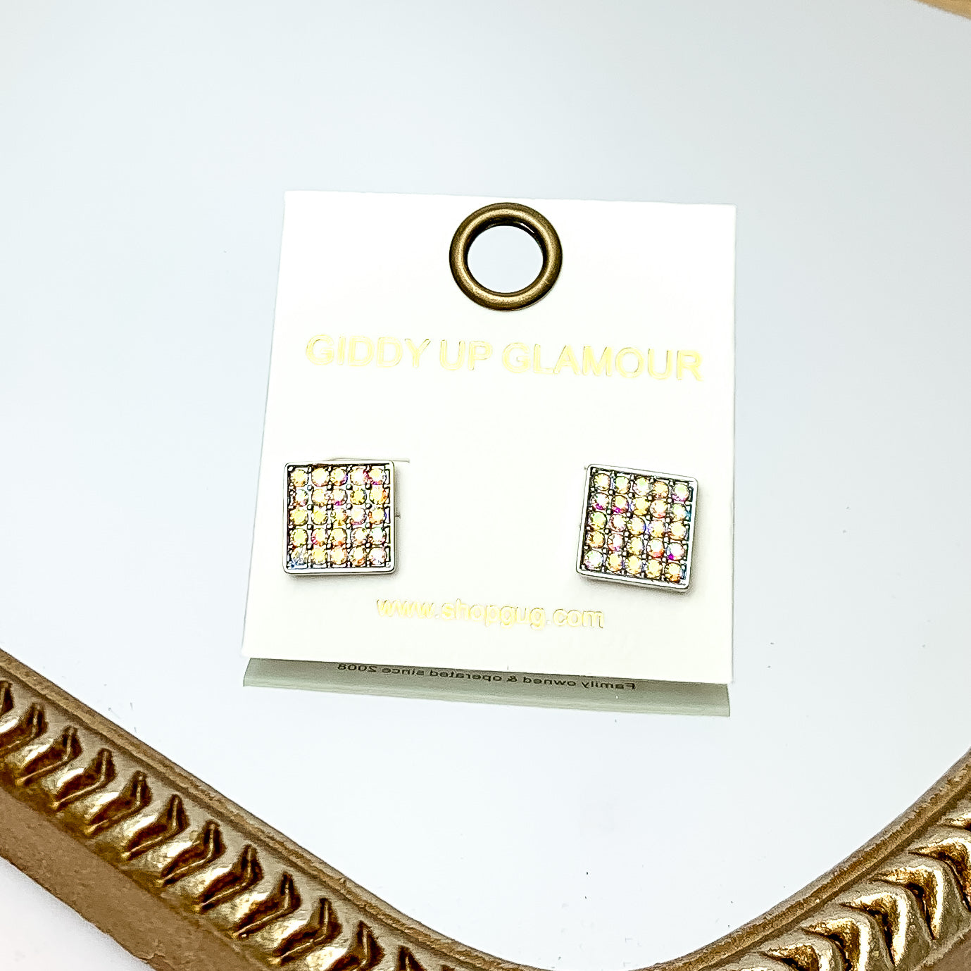 Square AB Crystal Stud Earrings in Silver Tone. These earrings are pictured on a white background with a gold frame around.