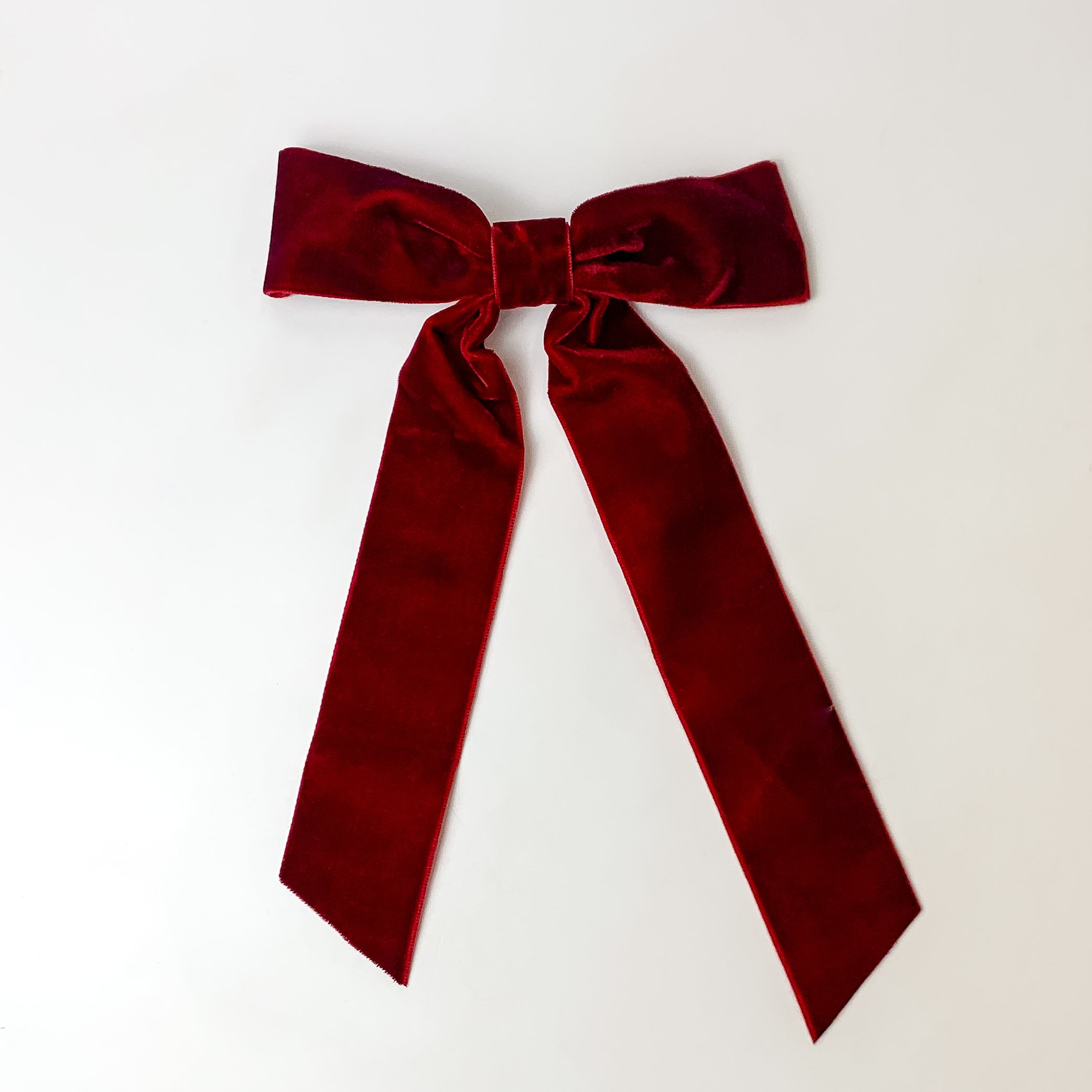 This beautiful crimson glory red bow is taken with a white background.