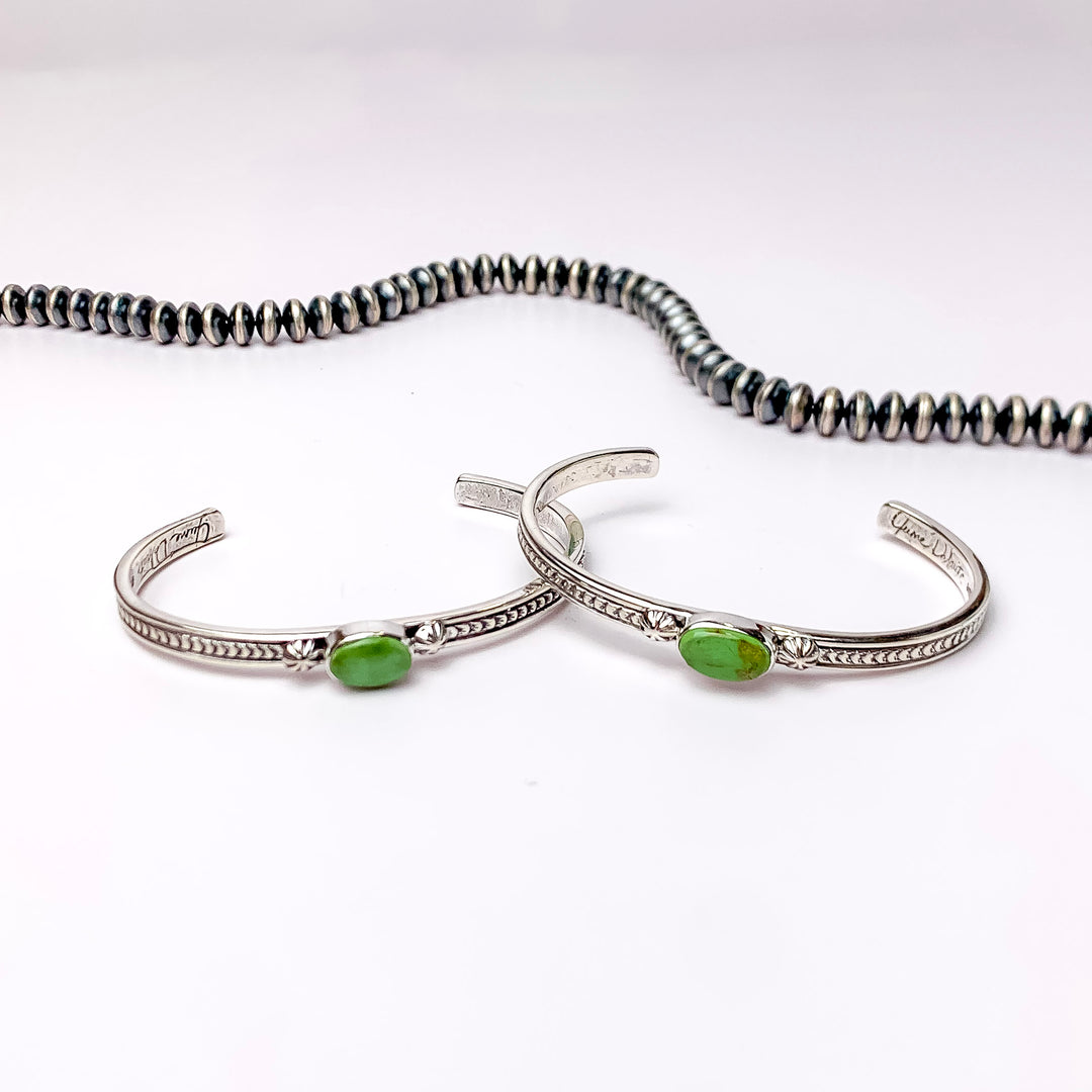 June Delauito | Navajo Handmade Sterling Silver Cuff Bracelet with a Single Green Turquoise Stone and Intricate Detailing - Giddy Up Glamour Boutique