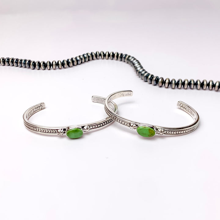 June Delauito | Navajo Handmade Sterling Silver Cuff Bracelet with a Single Green Turquoise Stone and Intricate Detailing - Giddy Up Glamour Boutique