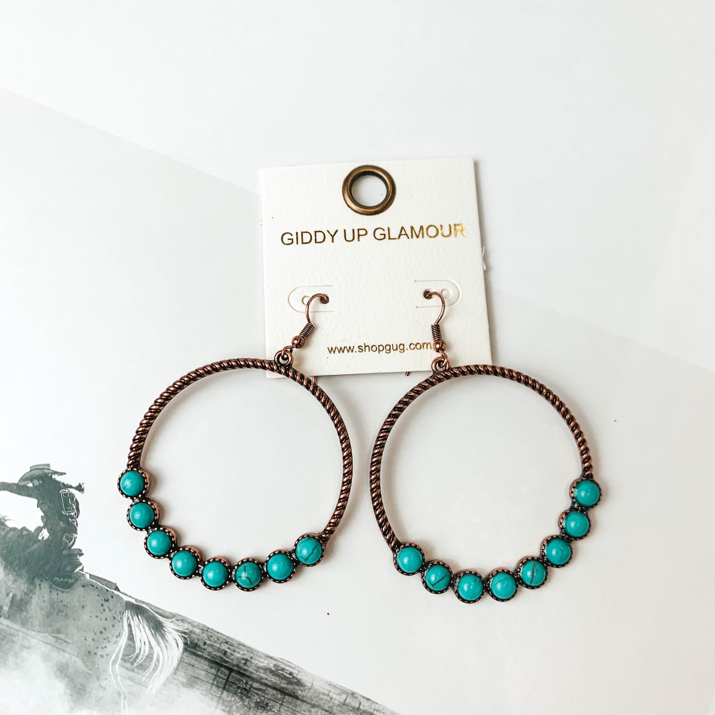 Forever Twisted Hoop Earrings with Stones in Turquoise. Pictured on a white background with a picture in the bottom left corner.