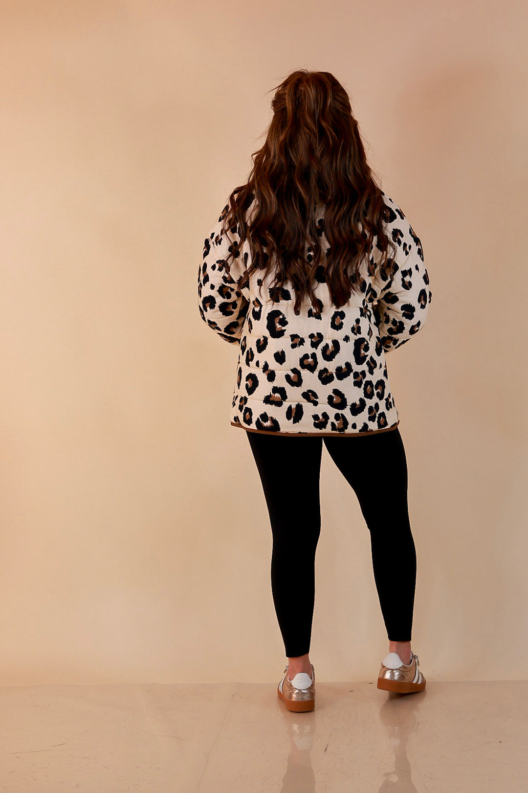 Into the Wild leopard print quilted jacket with brown piping in ivory