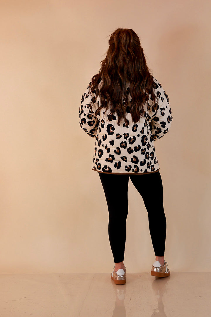 Into the Wild leopard print quilted jacket with brown piping in ivory