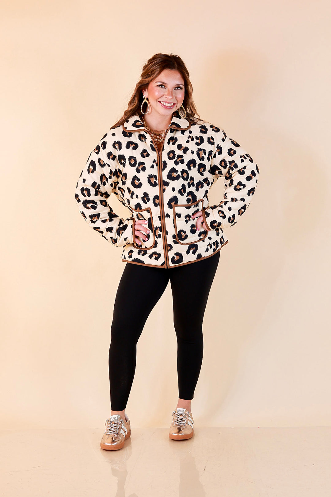 Into the Wild leopard print quilted jacket with brown piping in ivory