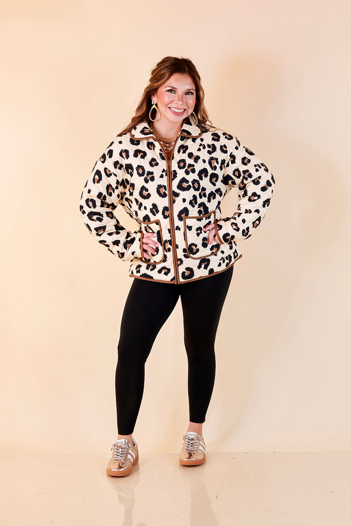Into the Wild leopard print quilted jacket with brown piping in ivory