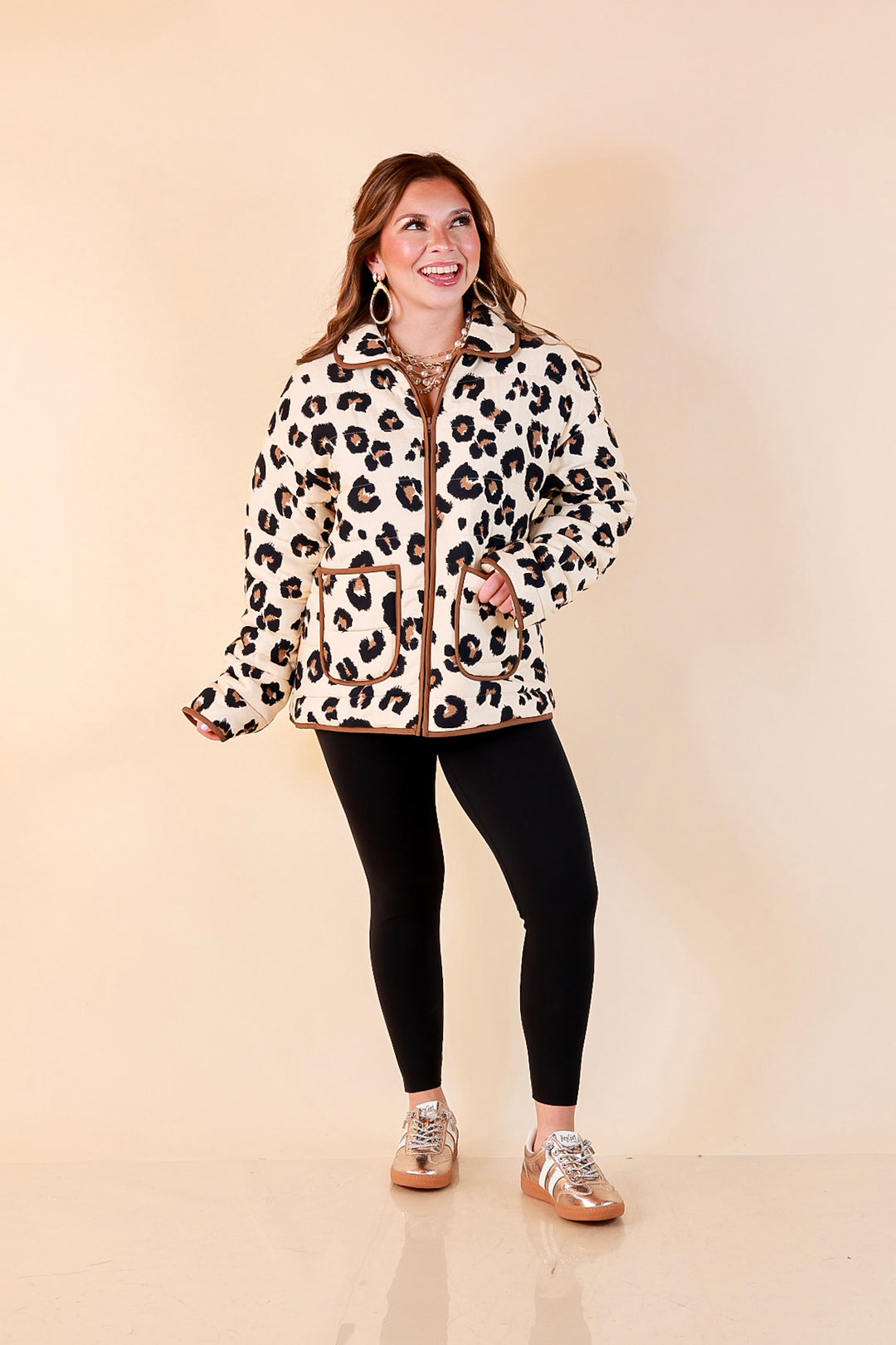 Into the Wild leopard print quilted jacket with brown piping in ivory