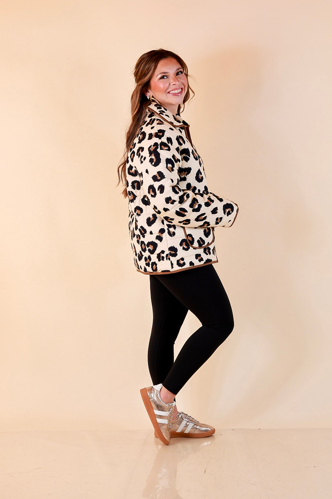 Into the Wild leopard print quilted jacket with brown piping in ivory