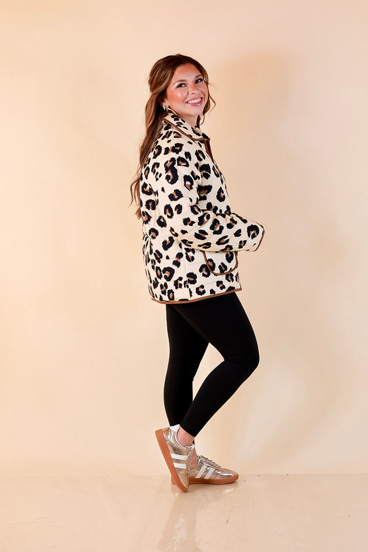 Into the Wild leopard print quilted jacket with brown piping in ivory