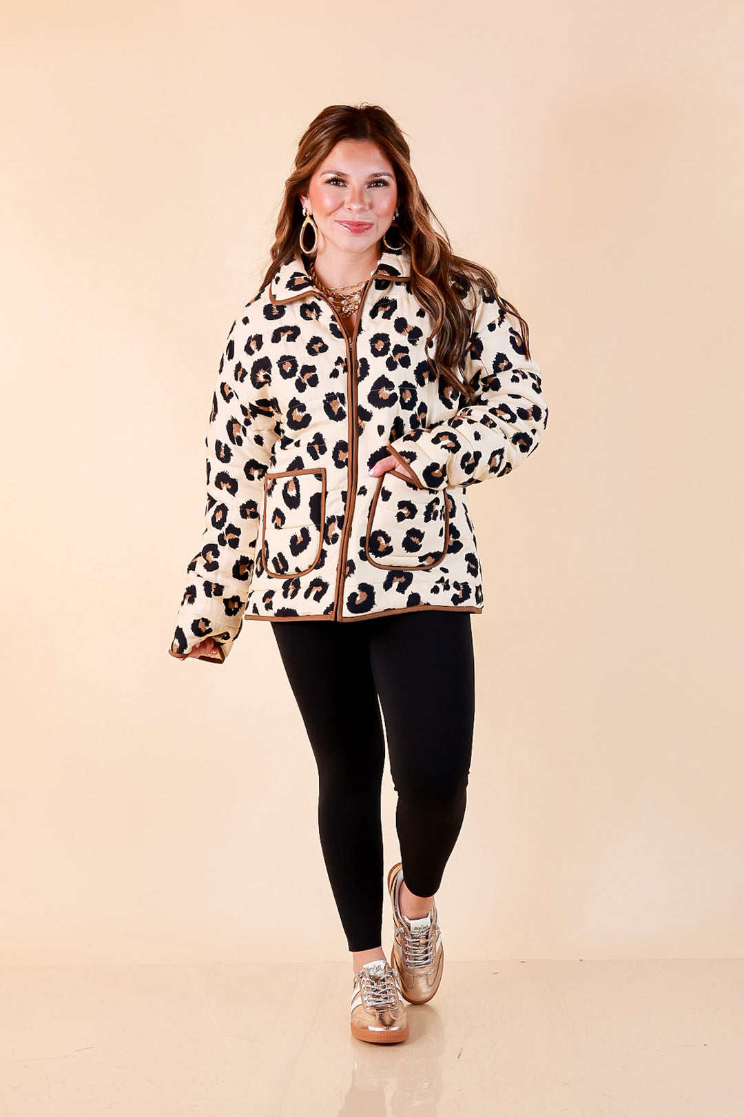 Into the Wild leopard print quilted jacket with brown piping in ivory