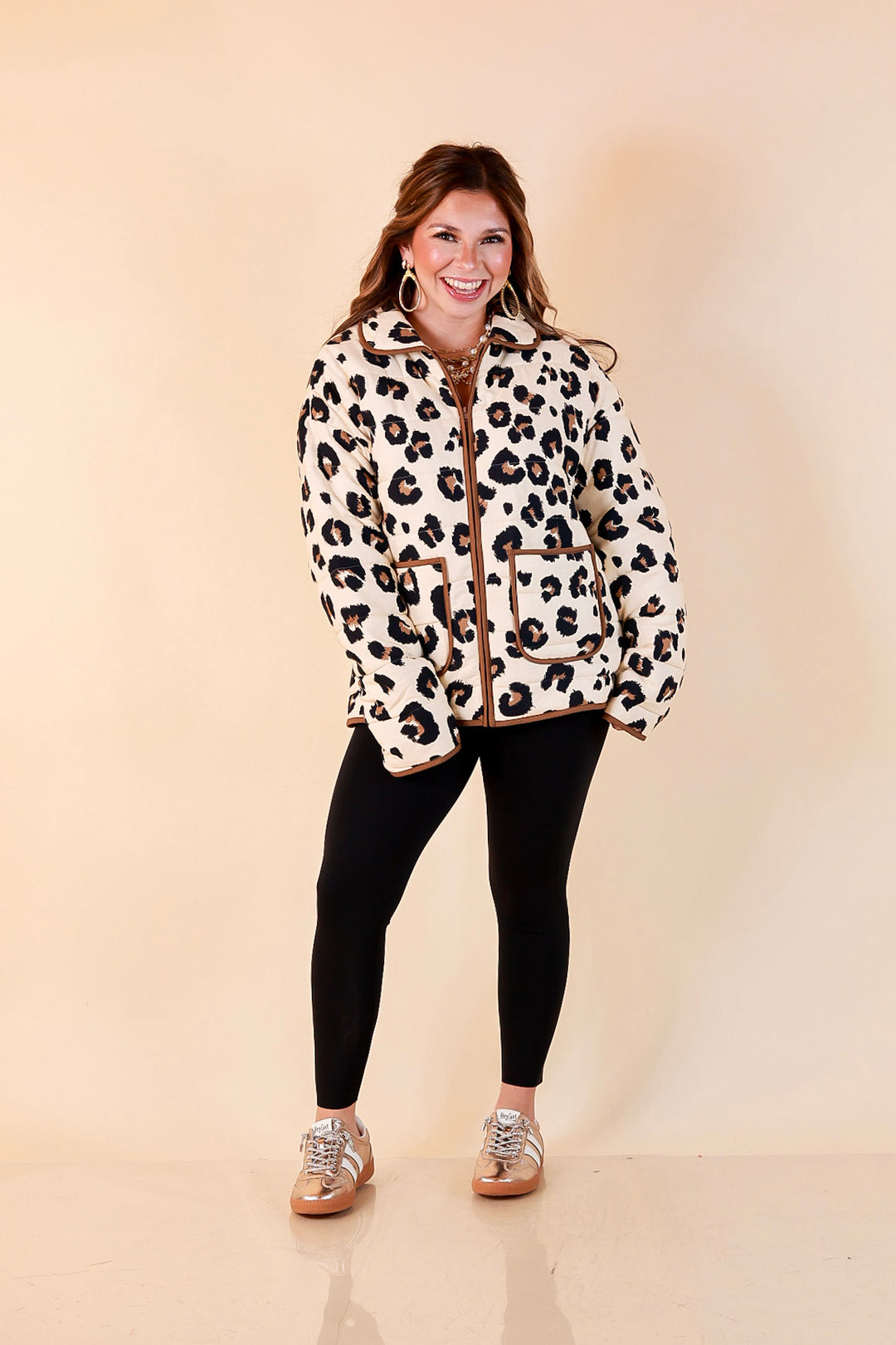 Into the Wild leopard print quilted jacket with brown piping in ivory