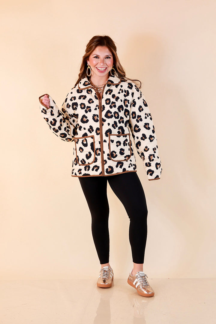 Into the Wild leopard print quilted jacket with brown piping in ivory