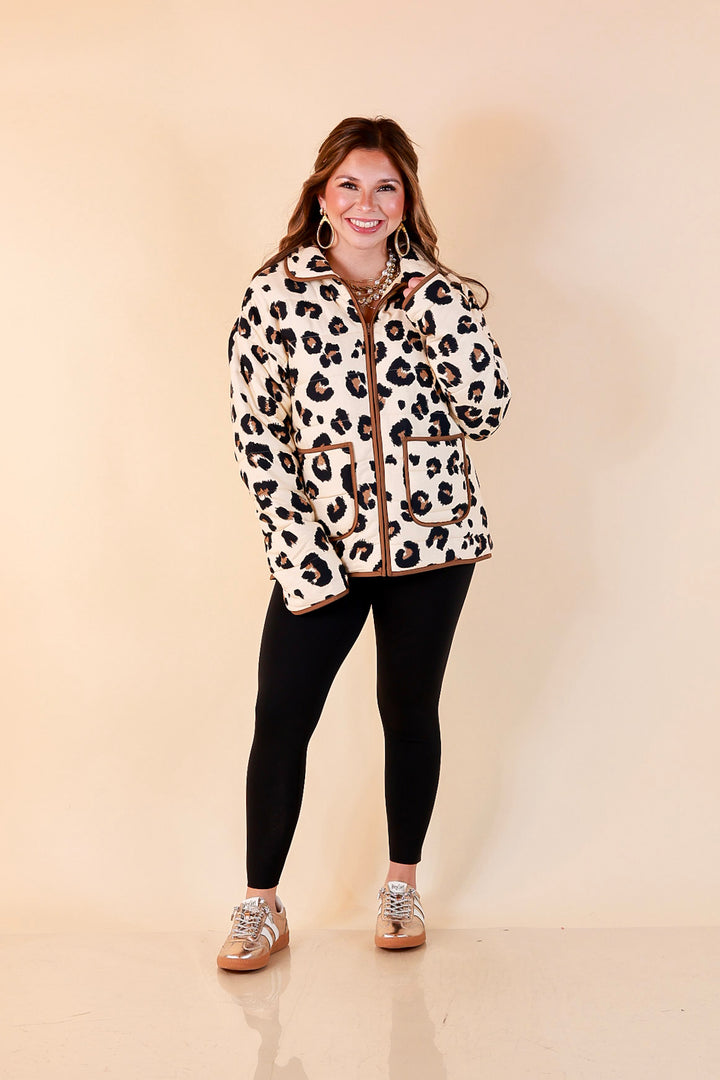Into the Wild leopard print quilted jacket with brown piping in ivory