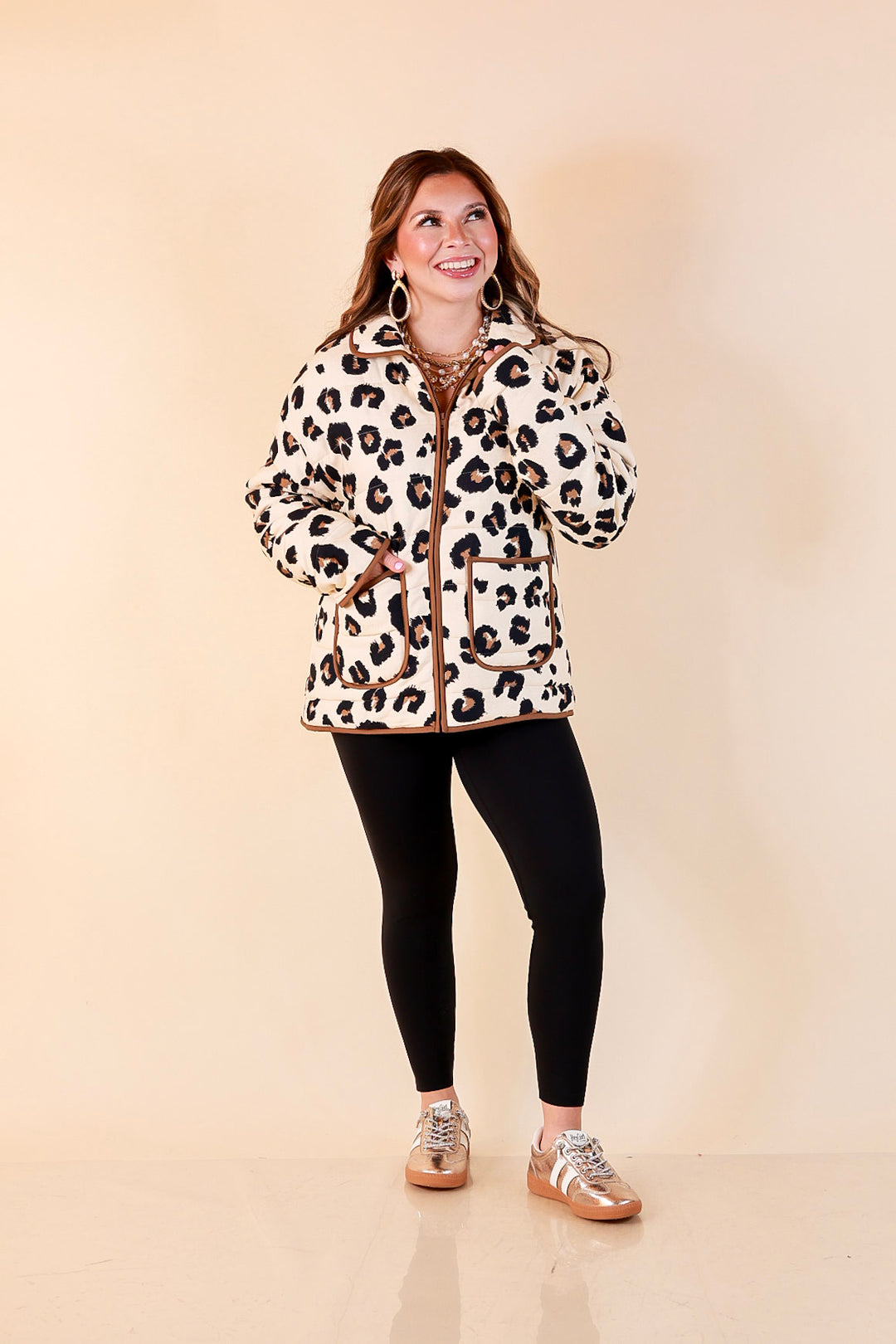 Into the Wild leopard print quilted jacket with brown piping in ivory