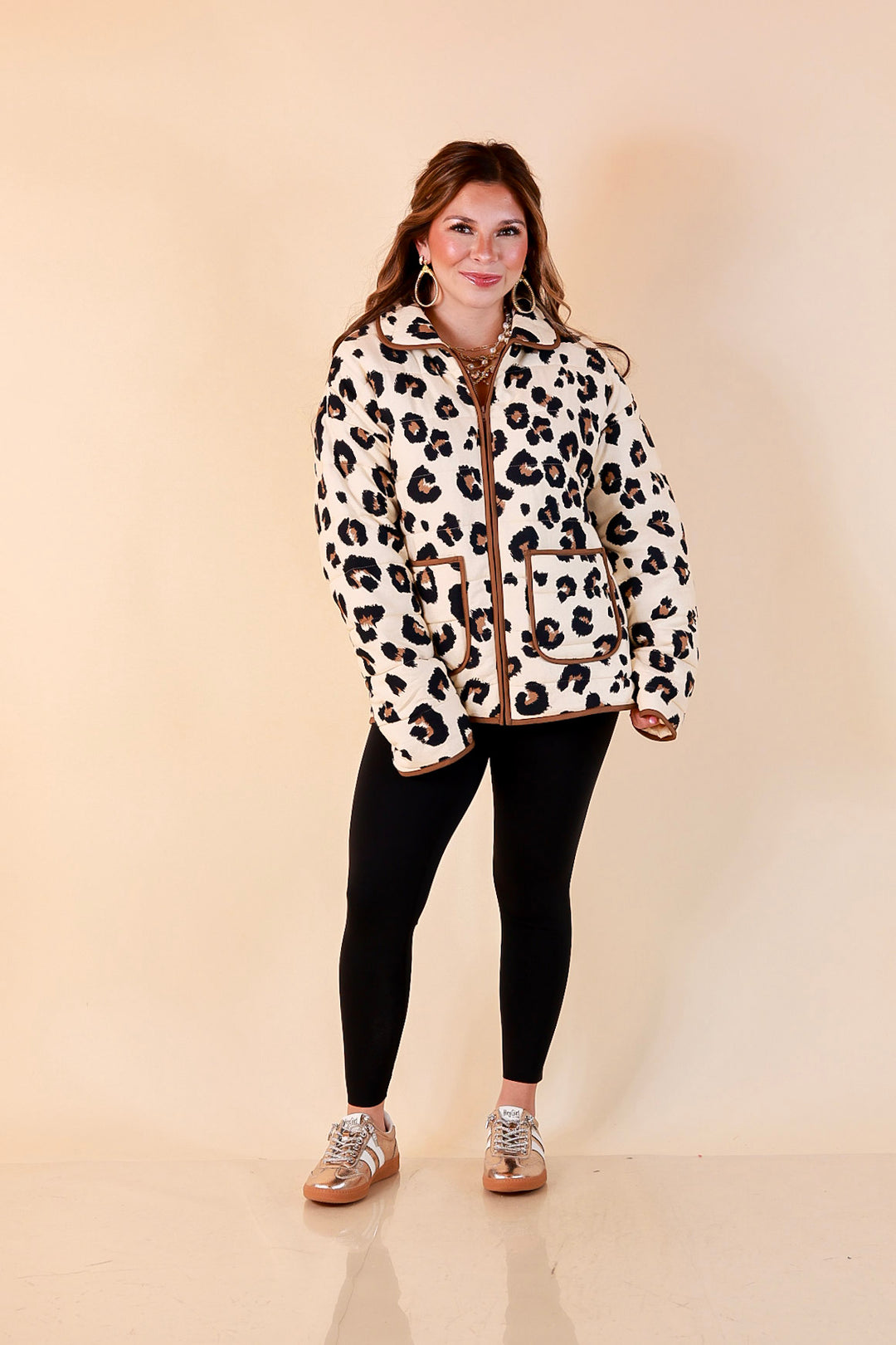Into the Wild leopard print quilted jacket with brown piping in ivory