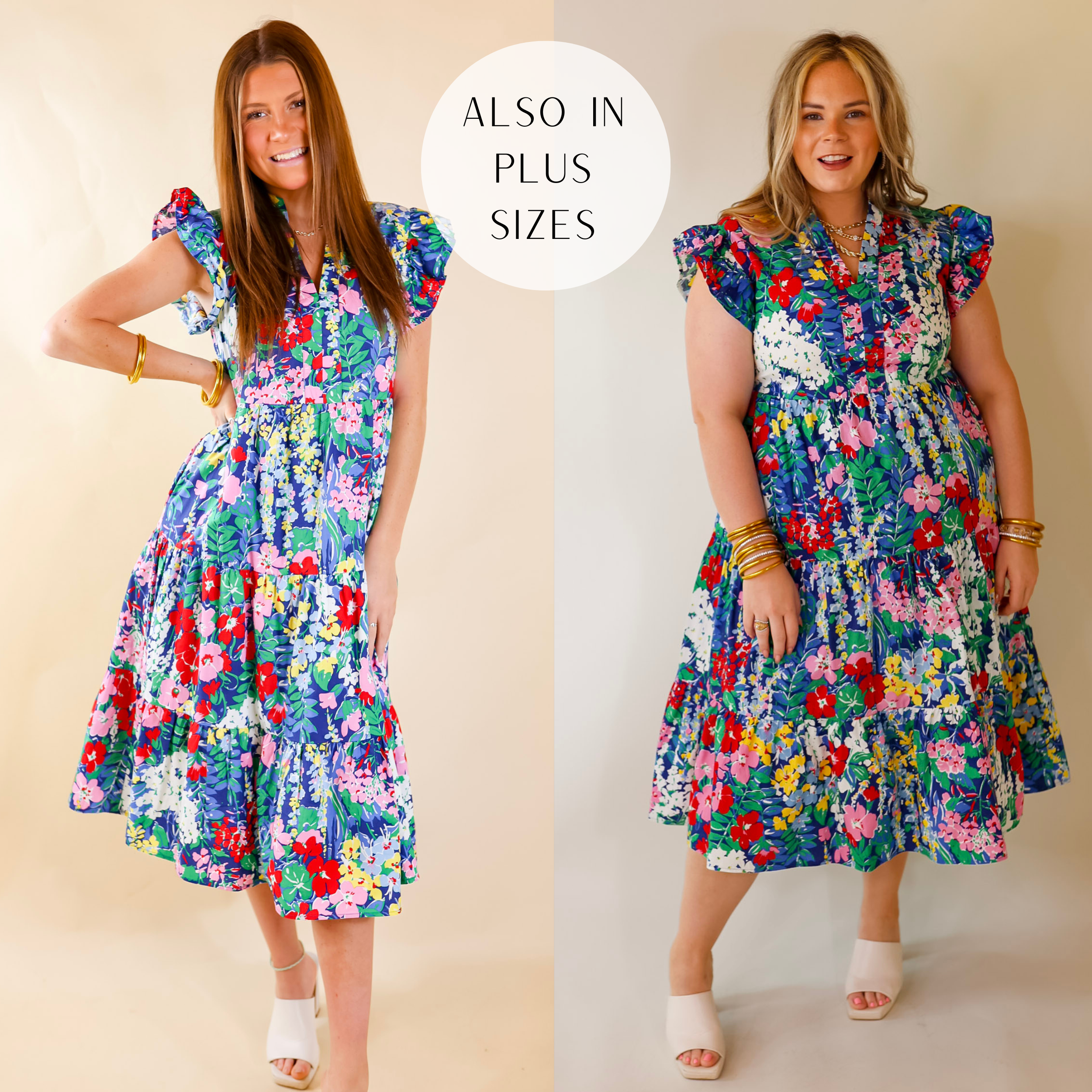 Model is wearing a midi length dress with a floral print and ruffle cap sleeves in blue. Model has this dress paired with gold jewelry and white heels. Background is solid tan.