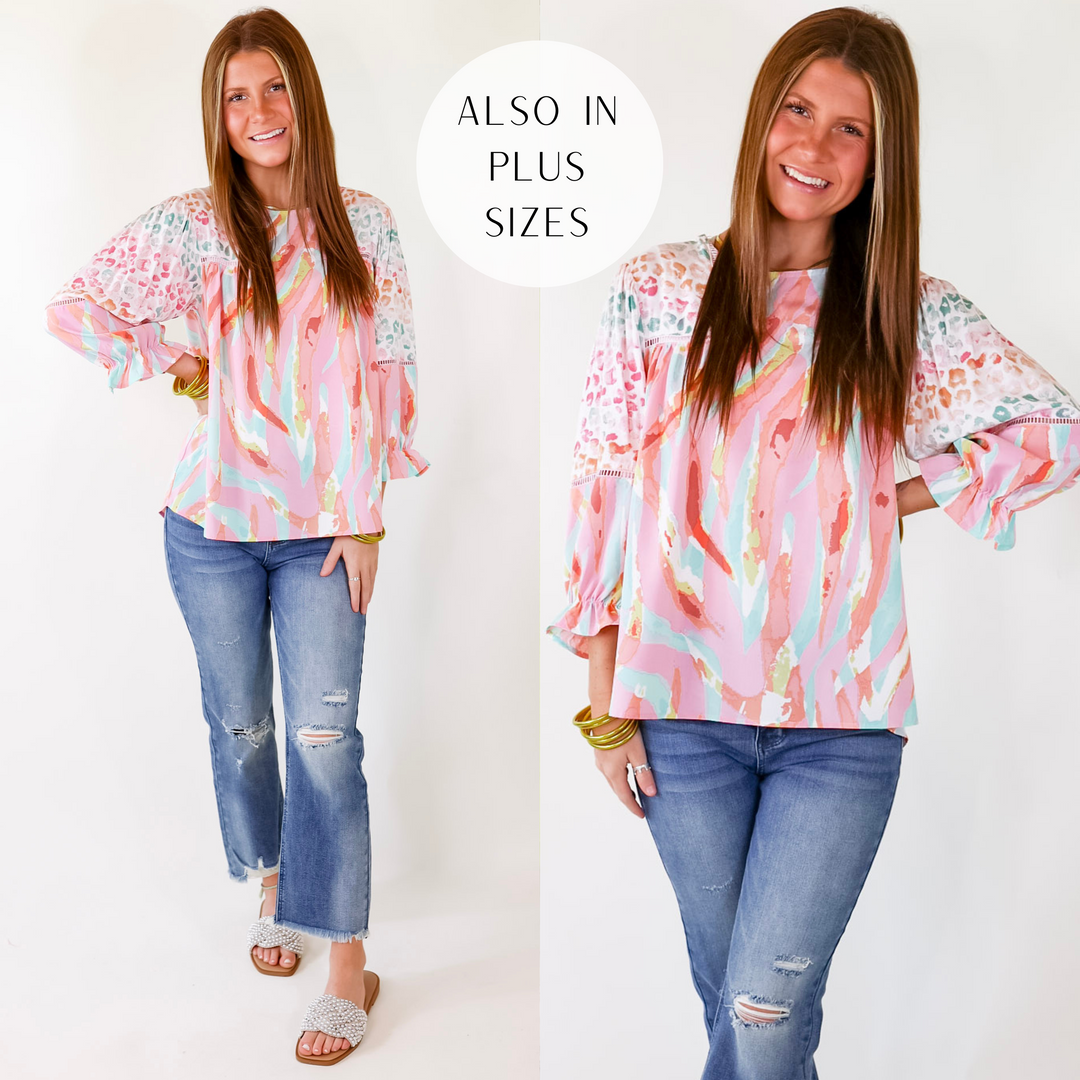 Model is wearing unique cheetah and paintbrush pattern top in pink with a white background