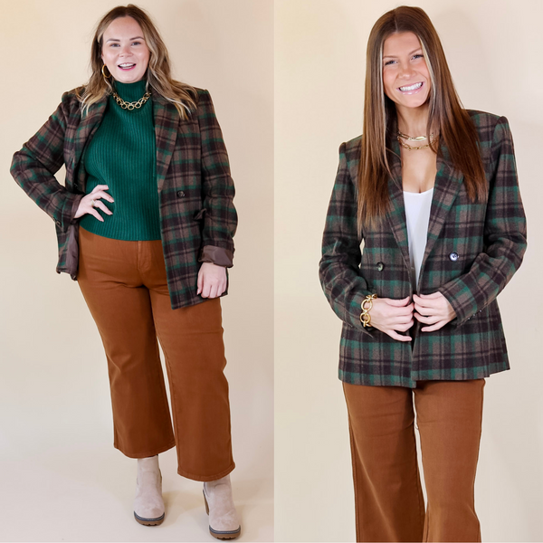 In the picture the model is wearing a plaid blazer in brown and green with a white background