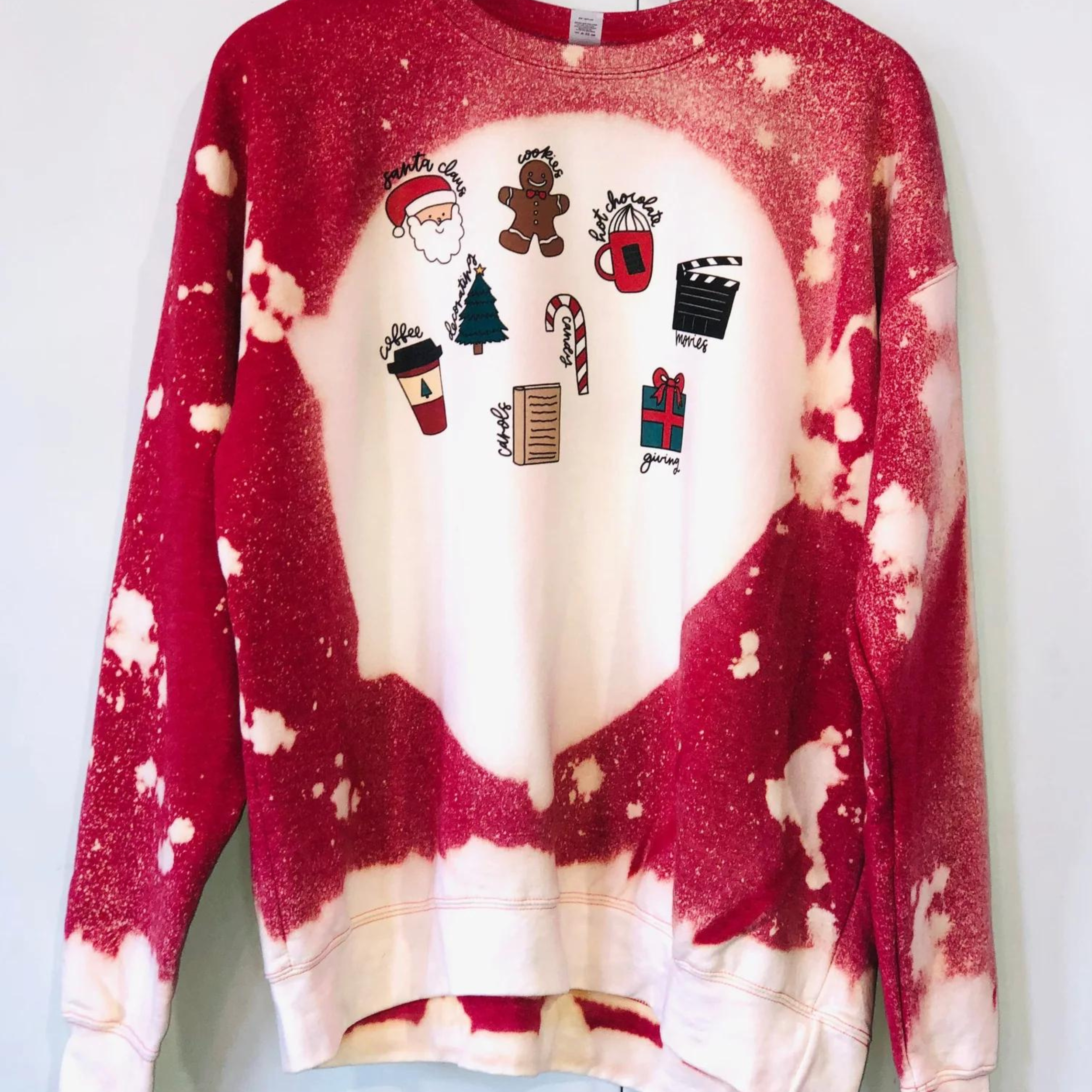 Online Exclusive | Seasons Greetings Christmas Icons Long Sleeve Bleached Splatter Graphic Sweatshirt in Red - Giddy Up Glamour Boutique
