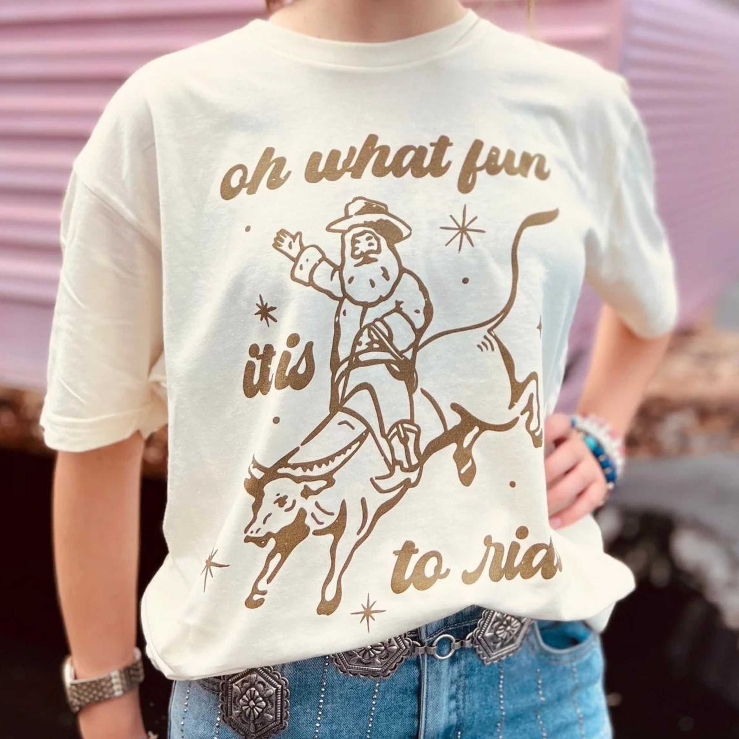 Online Exclusive | Oh What Fun It Is To Ride Graphic Tee in Cream - Giddy Up Glamour Boutique